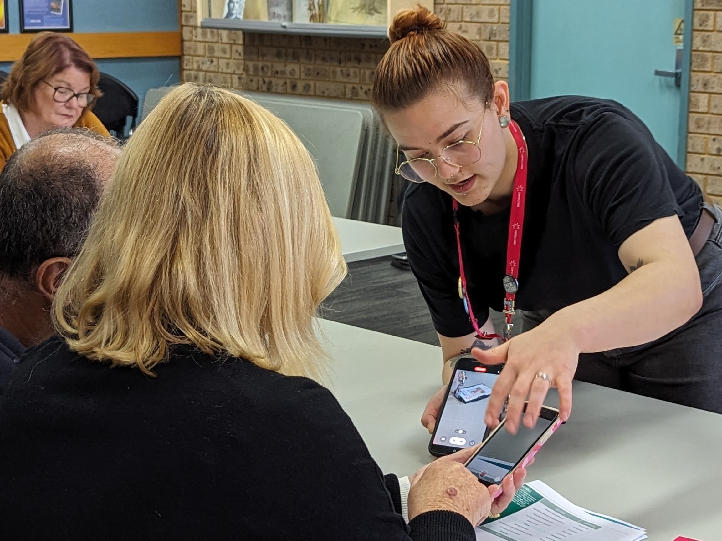 A young person demonstrating how to use a smartphone